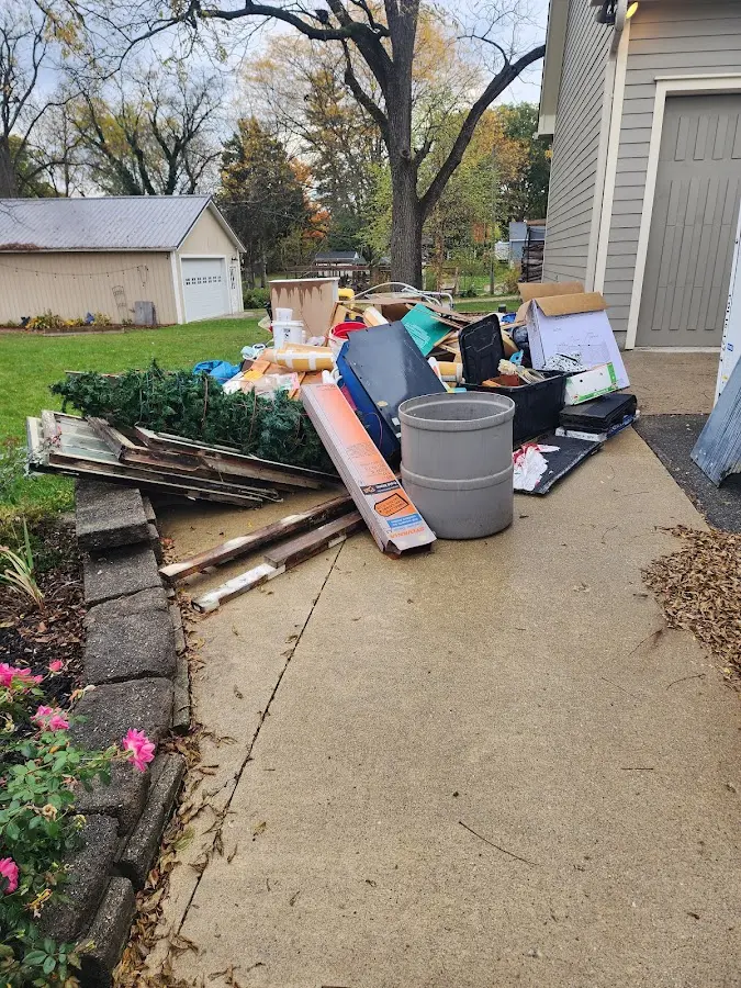 Dumpster being loaded with debris for Roofing Dumpster Rental in Georgetown